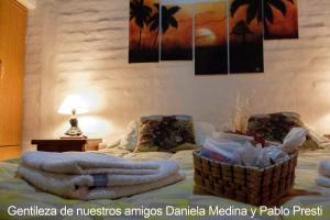 a room with a bed with towels on it at Villa El Refugio in Potrerillos