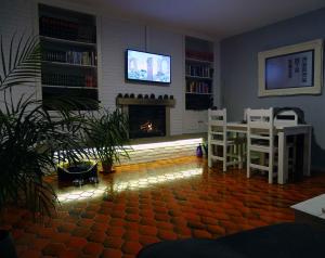 Televízia a/alebo spoločenská miestnosť v ubytovaní FocoLare