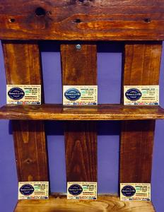 a wooden bench with signs on it at La Residencia B&B in Boca Chica