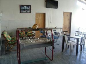 Et tv og/eller underholdning på CHACARA NOSSA SENHORA DAS DORES + 2 billeder