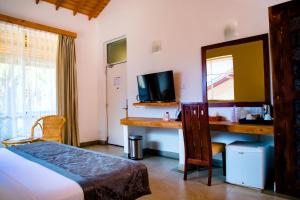 Letto o letti in una camera di Amaranthe Bay Resort & Spa