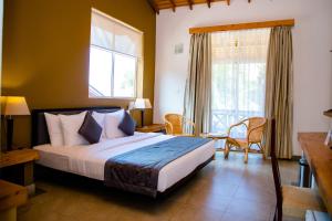 Letto o letti in una camera di Amaranthe Bay Resort & Spa