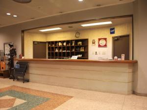 a lobby with a counter at Hotel ab Shiga in Otsu