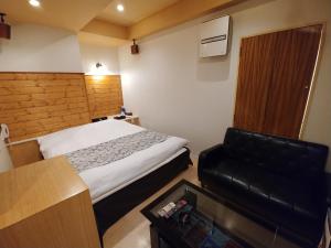Voodi või voodid majutusasutuse Hotel Allure (Adult Only) toas