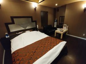 Voodi või voodid majutusasutuse Hotel Allure (Adult Only) toas