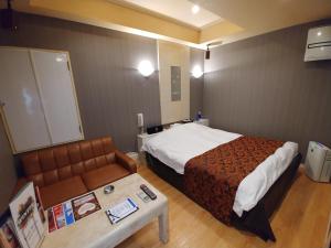 Voodi või voodid majutusasutuse Hotel Allure (Adult Only) toas