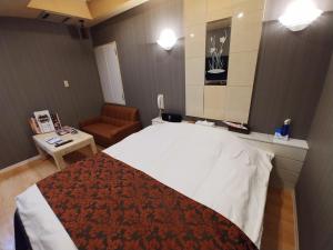 Voodi või voodid majutusasutuse Hotel Allure (Adult Only) toas