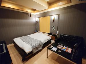 Voodi või voodid majutusasutuse Hotel Allure (Adult Only) toas