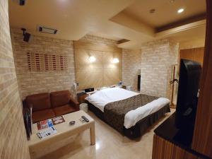 Voodi või voodid majutusasutuse Hotel Allure (Adult Only) toas
