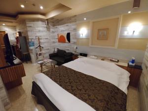 Voodi või voodid majutusasutuse Hotel Allure (Adult Only) toas