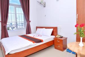 Postel nebo postele na pokoji v ubytování Sevensea Vung Tau