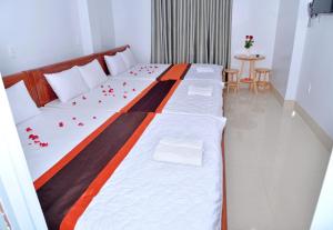 Postel nebo postele na pokoji v ubytování Sevensea Vung Tau
