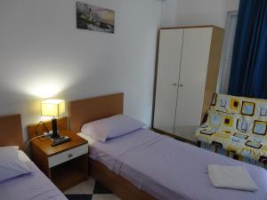 Postel nebo postele na pokoji v ubytování Apartments Ana
