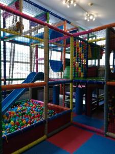 a play room with a bunch of different colored play equipment at Ośrodek Wypoczynkowy Zapalenica in Szczyrk