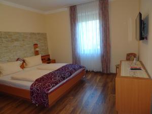 Postel nebo postele na pokoji v ubytování Hotel & Weinstube Restaurant Filling