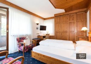 Postel nebo postele na pokoji v ubytování Residence MAYR
