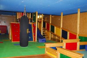 a play room with a gym with a large tire at Gasthof Bogenrieder in Waidhofen