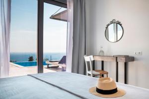 Postel nebo postele na pokoji v ubytování Mystique View Villas