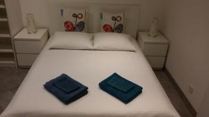 Tempat tidur dalam kamar di Appartement Vue Montagne