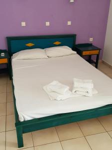 Ein Bett oder Betten in einem Zimmer der Unterkunft Mikes Apartment