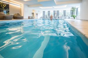 The swimming pool at or close to Vitaurina Royal Hotel