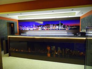 a bar with a view of a city at night at Hotel Amigos in Obzor +13 photos
