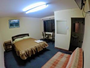 Residencial Uruguay tesisinde bir odada yatak veya yataklar