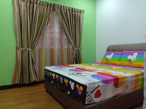 Postel nebo postele na pokoji v ubytování Sekinchan Paddy via Seaview Home 高楼 看海 稻田 民宿
