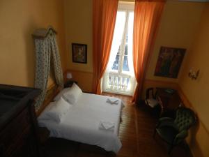 A bed or beds in a room at Bigo Guest House