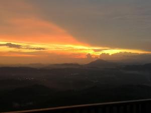 a sunset from the top of a mountain at Kairos Villa in Seremban