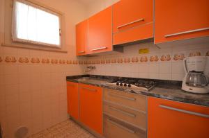 Køkken eller tekøkken på Villaggio Michelangelo - Lemene