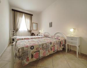 מיטה או מיטות בחדר ב-Appartamenti Le Terme