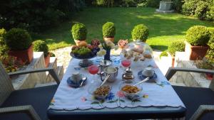 a table with food on top of it at B&B La Villa Mediterranea in Passirano