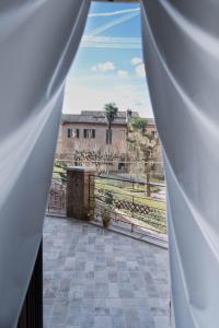 a view of a courtyard from a window of a building at Terrazza sull'infinito in Recanati