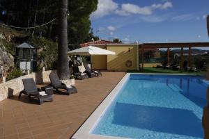 Bazén v ubytování Hotel Rural Rocha da Gralheira nebo v jeho okolí