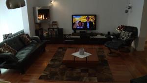 TV a/nebo společenská místnost v ubytování Sands