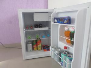 an open refrigerator filled with drinks and drinks at Hotel Farrapos in Porto Alegre +18 photos
