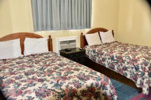 Postel nebo postele na pokoji v ubytování Extended Stay Motel - Snyder