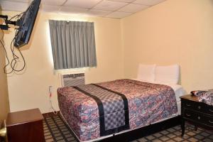 Postel nebo postele na pokoji v ubytování Extended Stay Motel - Snyder