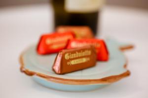 a plate with three different types of chocolates on it at Sarzana's Rooms in Sarzana