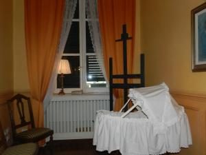 A bed or beds in a room at Bigo Guest House