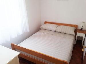 Postel nebo postele na pokoji v ubytování Apartments Carmen Vinisce