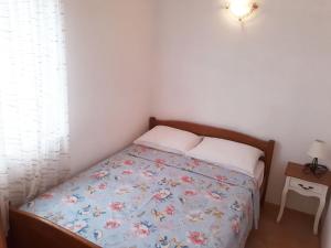 Postel nebo postele na pokoji v ubytování Apartments Carmen Vinisce