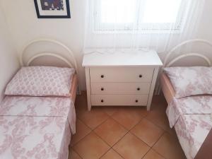 Postel nebo postele na pokoji v ubytování Apartments Carmen Vinisce