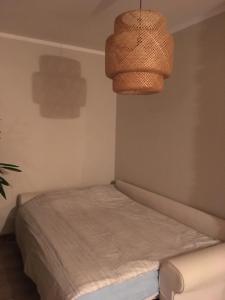 Postel nebo postele na pokoji v ubytování Studio na "Tęczowym Wzgórzu"