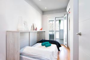 Postel nebo postele na pokoji v ubytování tuGuest Clave de Sol Apartment