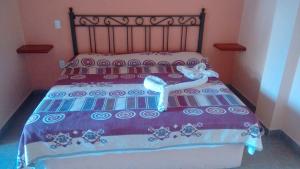 Giường trong phòng chung tại Hotel Posada La Pastrana +2 ảnh