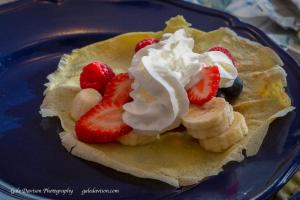 
a banana split on a plate with strawberries at Clary Lake Bed and Breakfast in Jefferson

