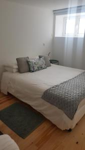Postel nebo postele na pokoji v ubytování Carmo Apartment