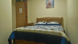 Postel nebo postele na pokoji v ubytování Hostal Inca